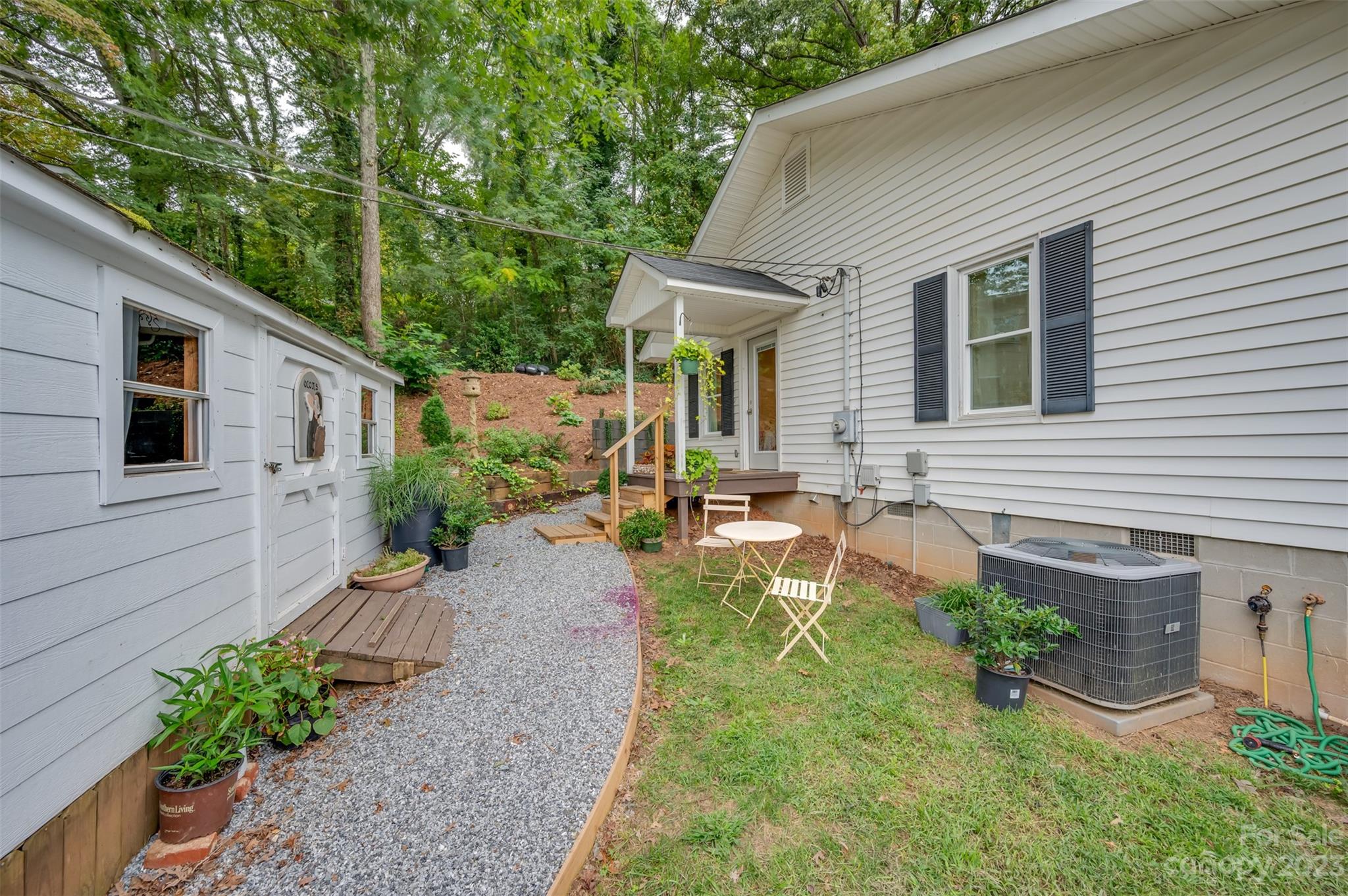 196 Screven Road Tryon, NC 28782 - Photo 25 of 31 a front view of a house with garden