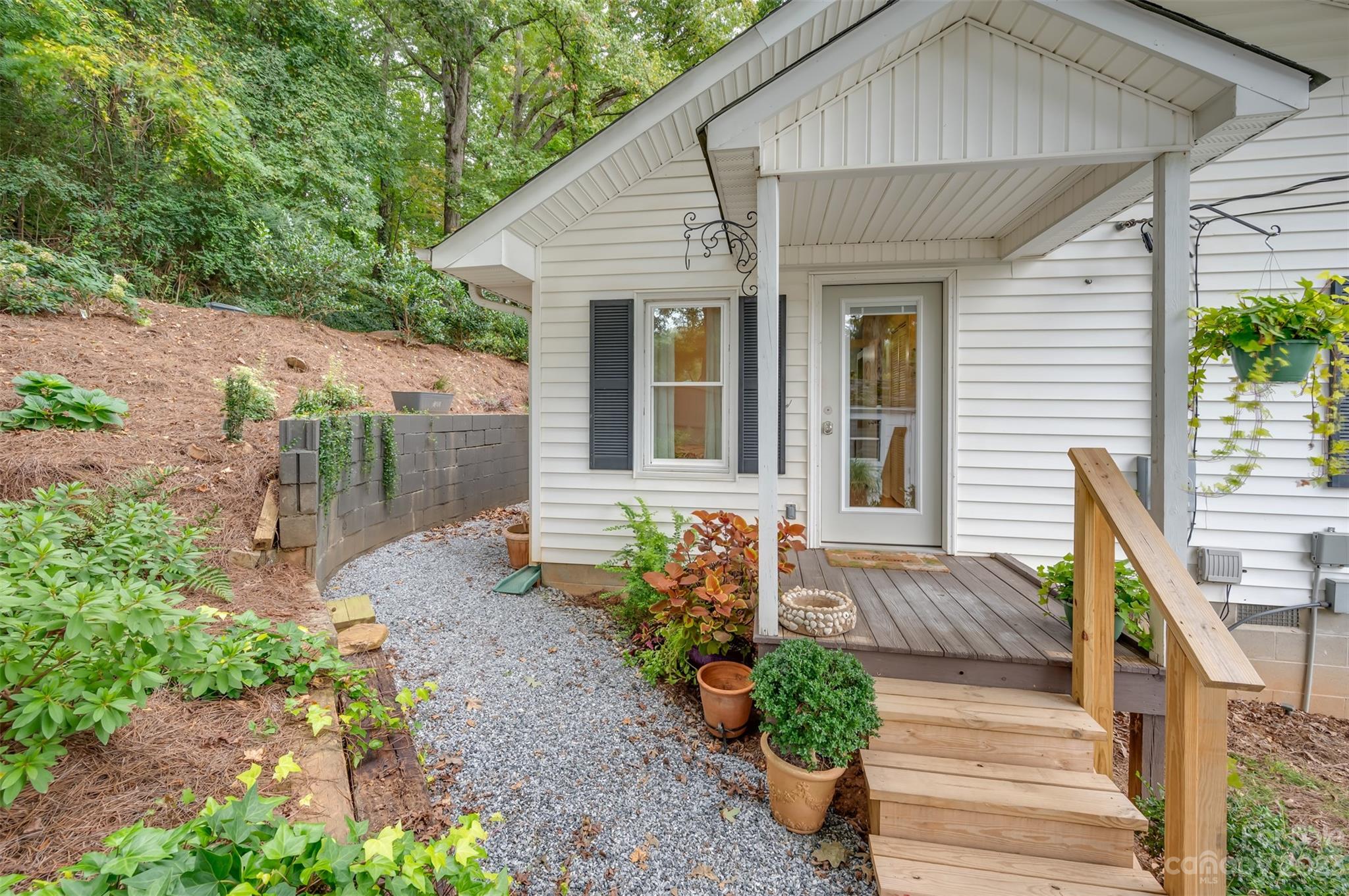 196 Screven Road Tryon, NC 28782 - Photo 26 of 31 a front view of a house with garden