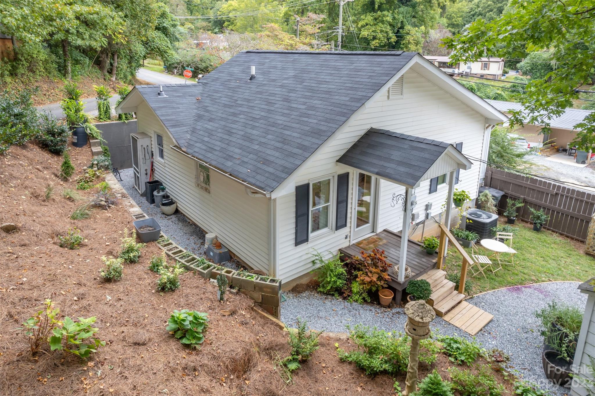 196 Screven Road Tryon, NC 28782 - Photo 30 of 31 an aerial view of a house with a yard and potted plants