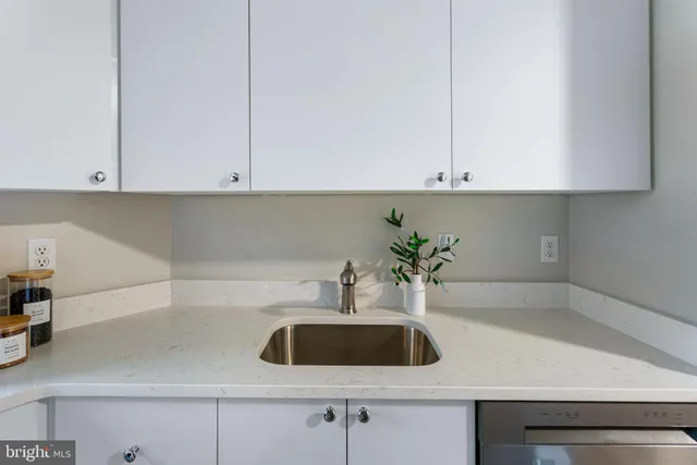 a kitchen with a sink and cabinets