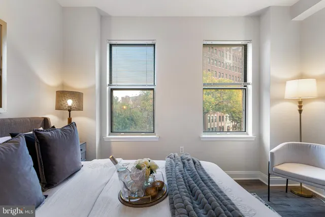 a bedroom with bed and a window