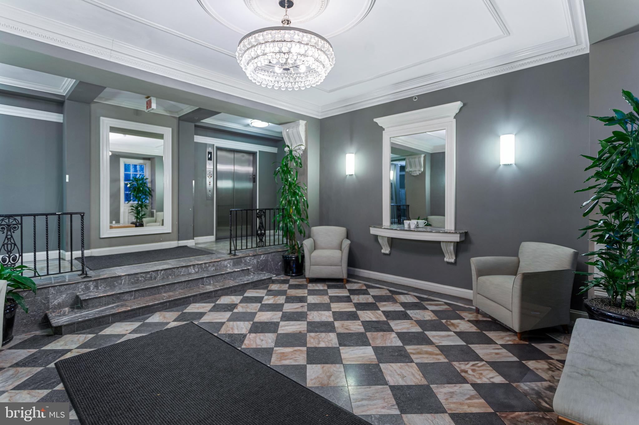 1621 T Street Northwest, Unit 305 Washington, DC 20009 - Photo 32 of 33 a view of a hallway with a chandelier and dining area