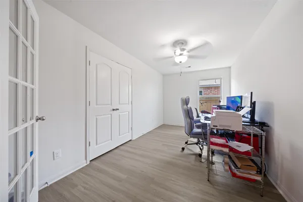 a workspace with furniture and wooden floor