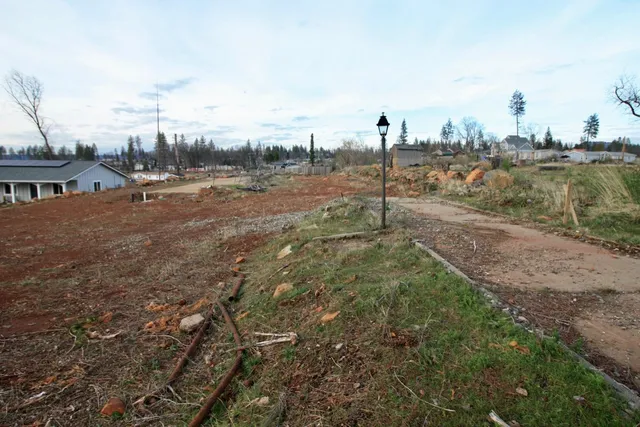 a view of a town with mountains in the background