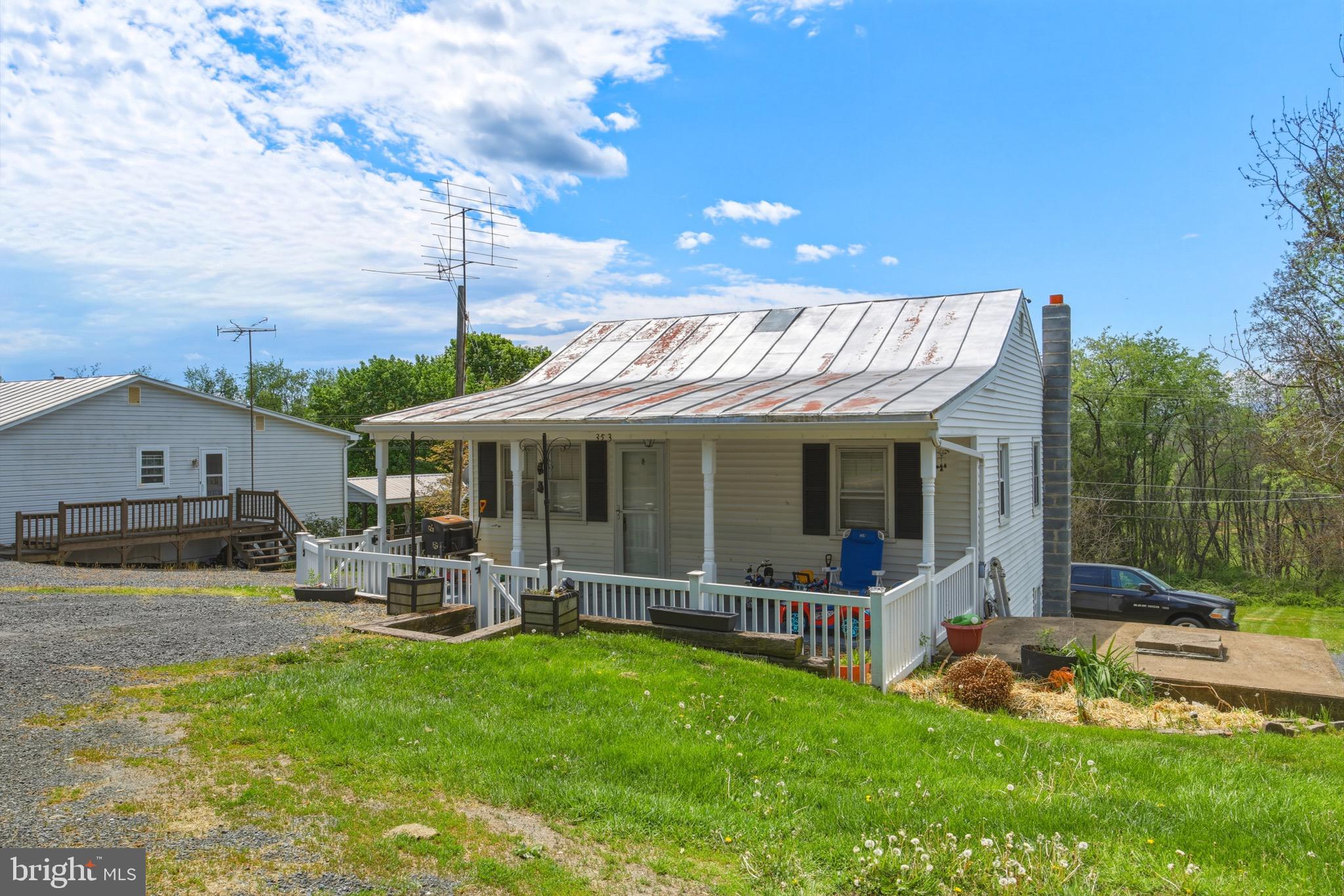 353 Turkey Knob Road Quicksburg, VA 22847 - Photo 1 of 35 a view of a house with backyard porch and sitting area