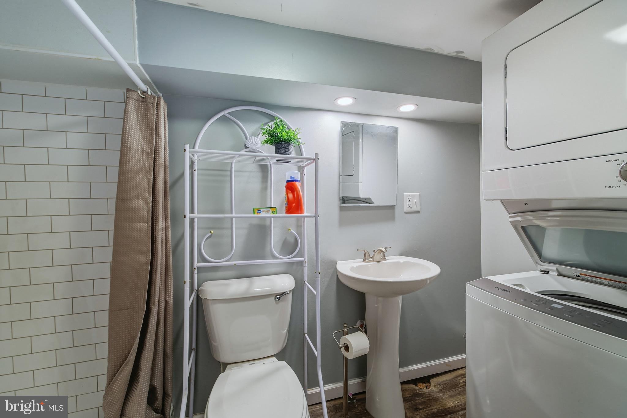353 Turkey Knob Road Quicksburg, VA 22847 - Photo 17 of 35 a bathroom with a toilet a sink and a shower