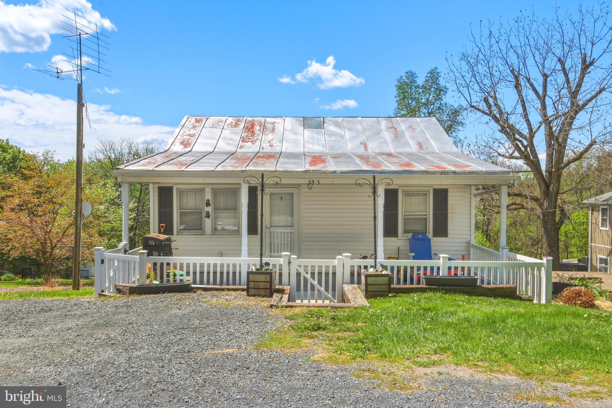 353 Turkey Knob Road Quicksburg, VA 22847 - Photo 20 of 35 a front view of a house with a yard