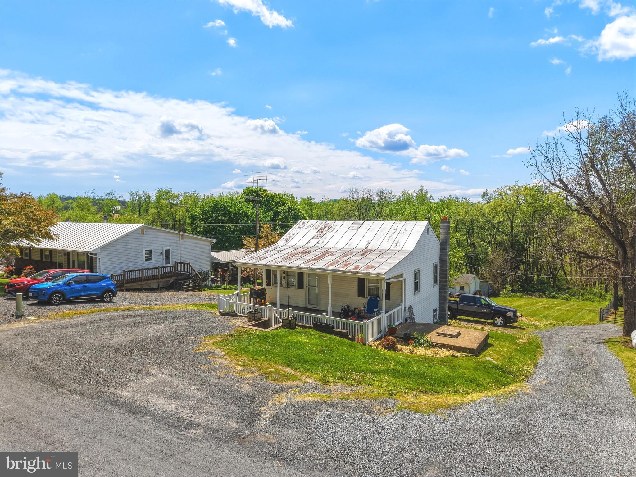 353 Turkey Knob Road Quicksburg, VA 22847 - Photo 22 of 35 a view of a house with a big yard and large trees