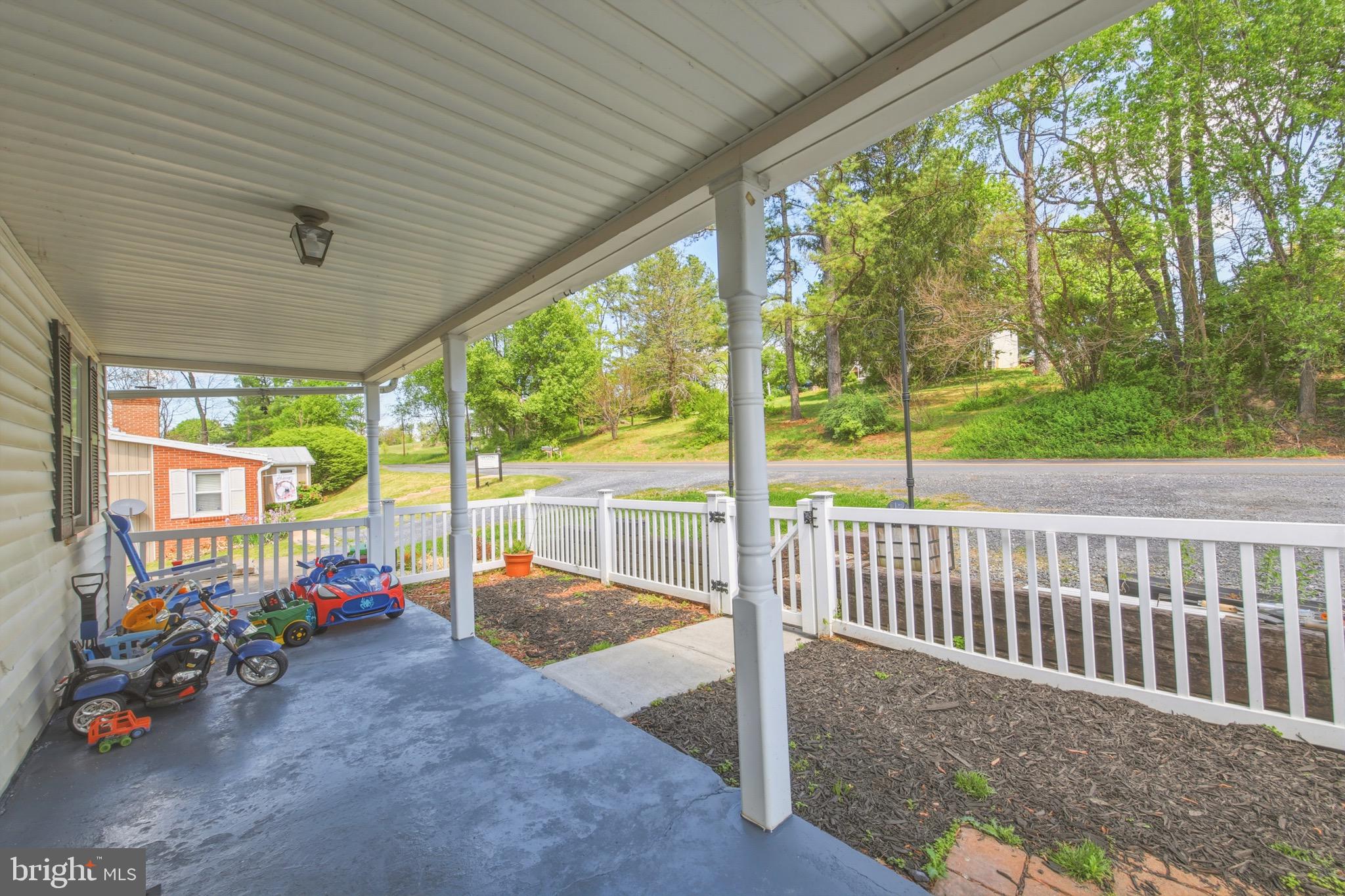 353 Turkey Knob Road Quicksburg, VA 22847 - Photo 3 of 35 a view of a porch with furniture and backyard