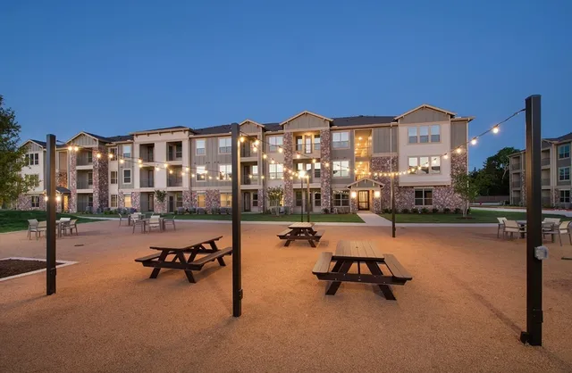 a building outdoor space with patio area and glass door