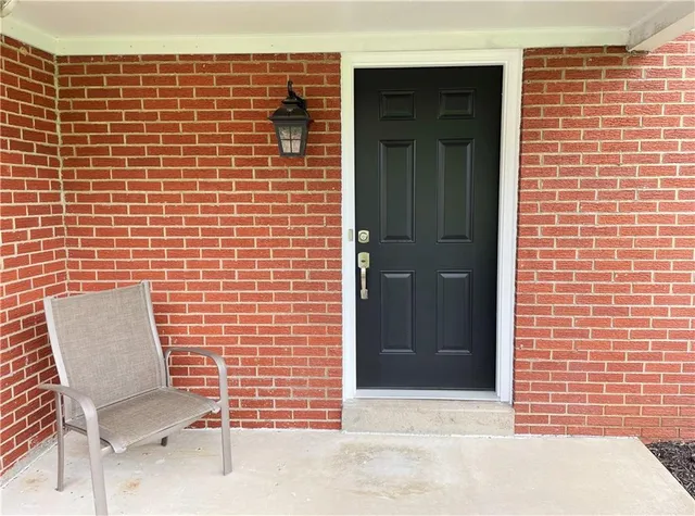 a brick building with a chair