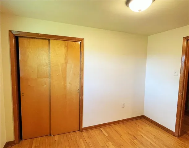 a bathroom with a sink and mirror with toilet
