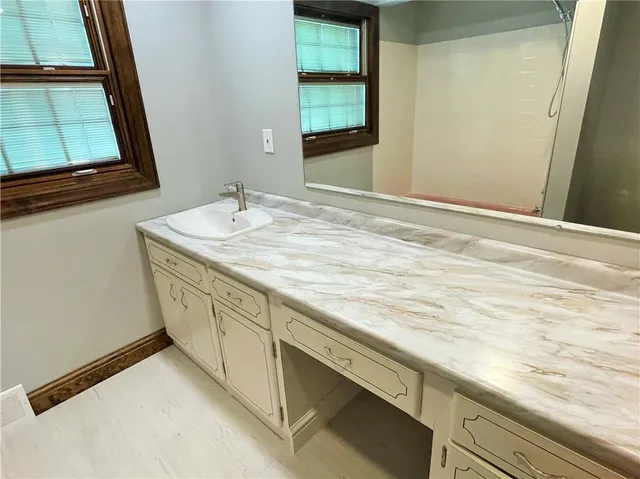 a view of a room with a bed