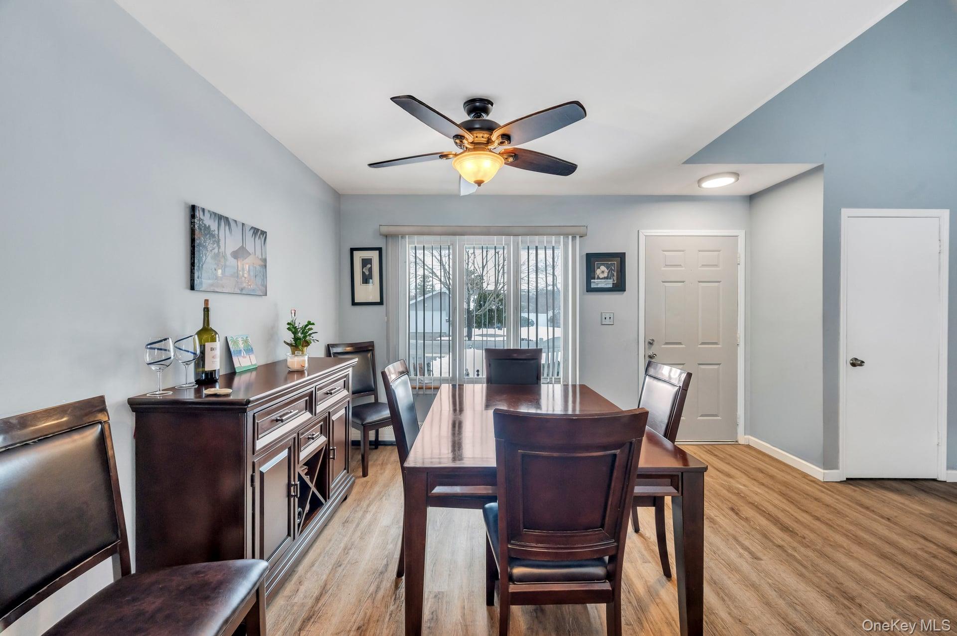17 Groton Lane Coram, NY 11727 - Photo 15 of 34 a view of a dining room with furniture window and wooden floor