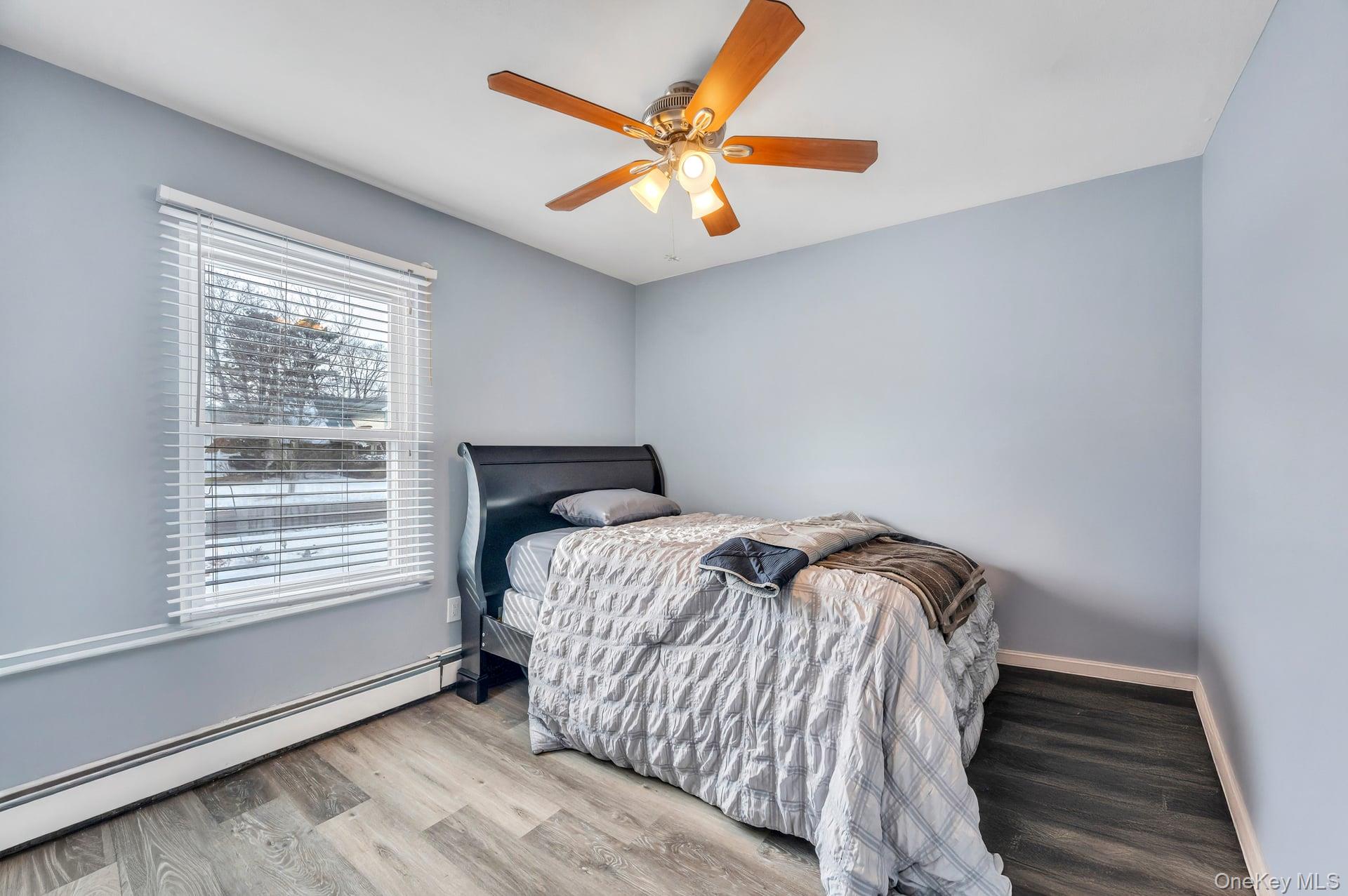 17 Groton Lane Coram, NY 11727 - Photo 24 of 34 a bedroom with a bed and window