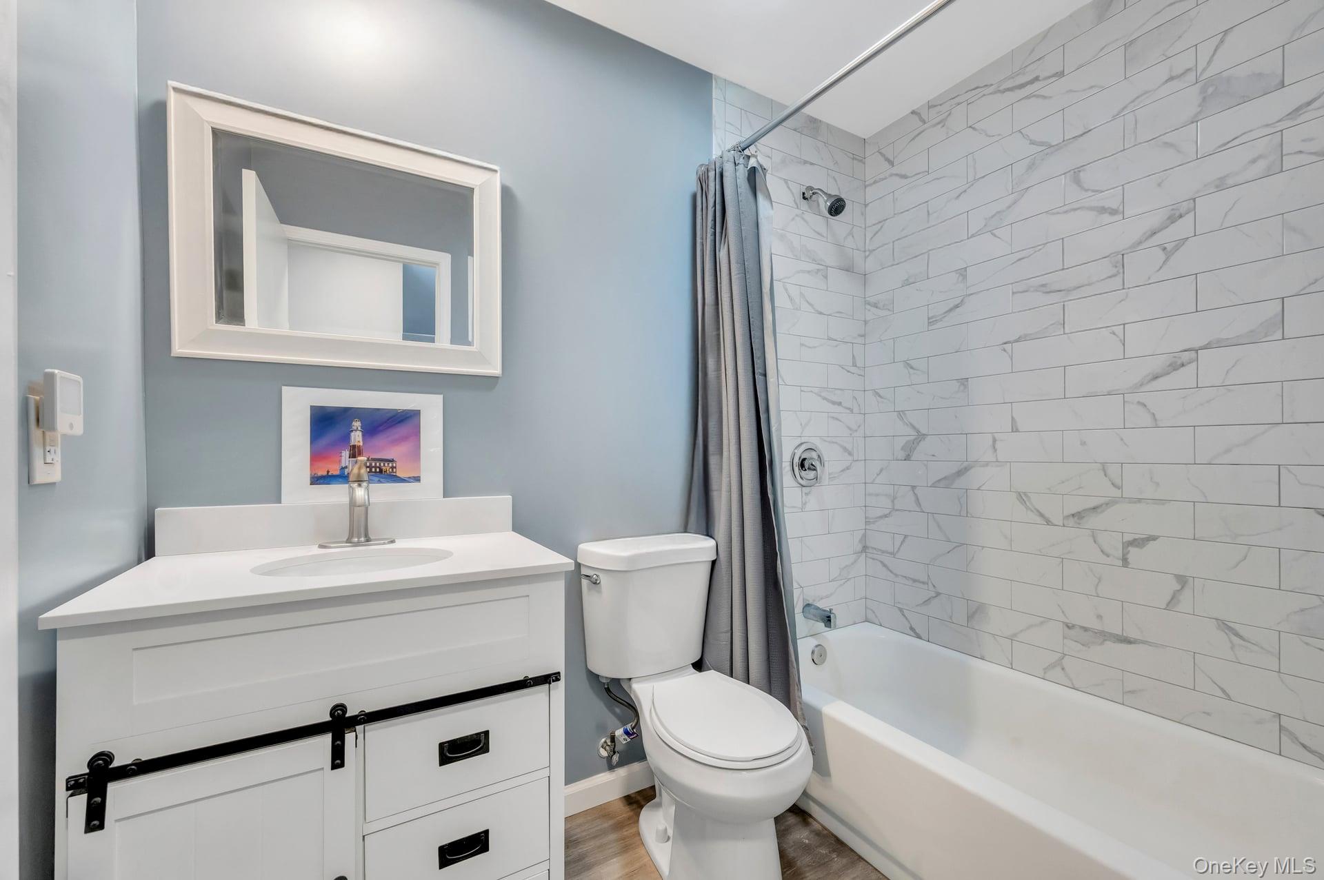 17 Groton Lane Coram, NY 11727 - Photo 26 of 34 a bathroom with a sink toilet and shower