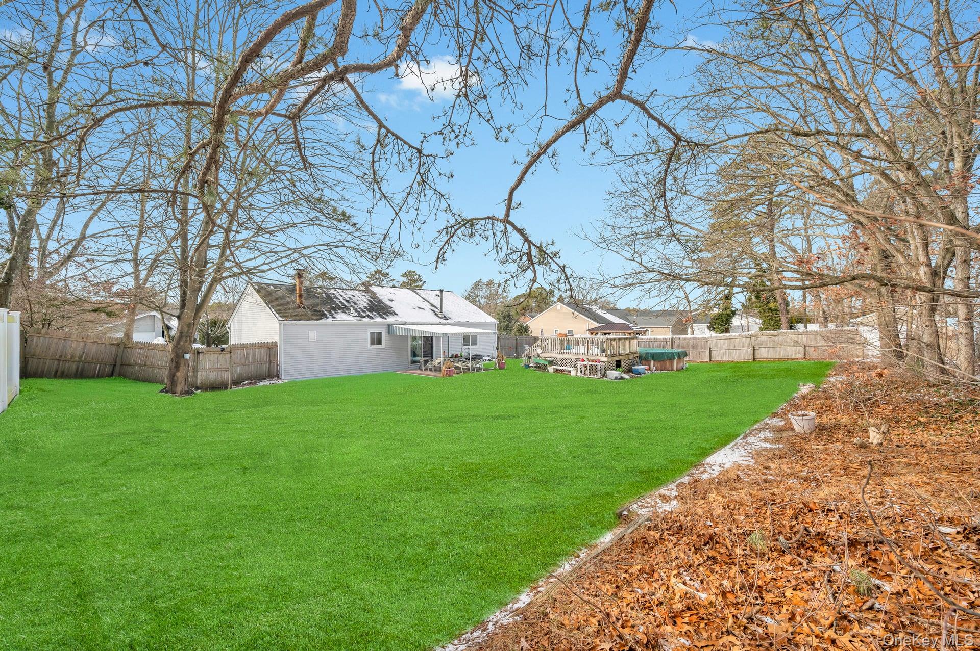 17 Groton Lane Coram, NY 11727 - Photo 29 of 34 a view of a house with a yard
