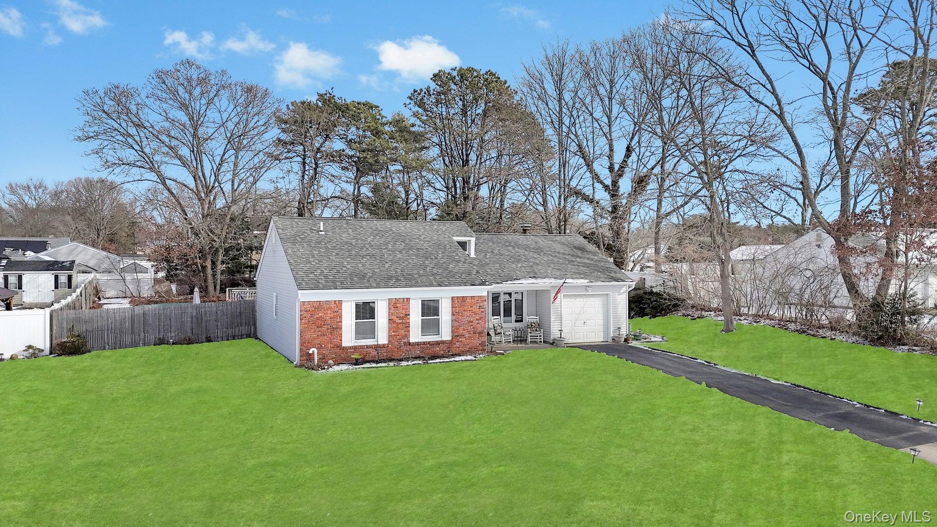 17 Groton Lane Coram, NY 11727 - Photo 5 of 34 a view of a house with a big yard and large trees