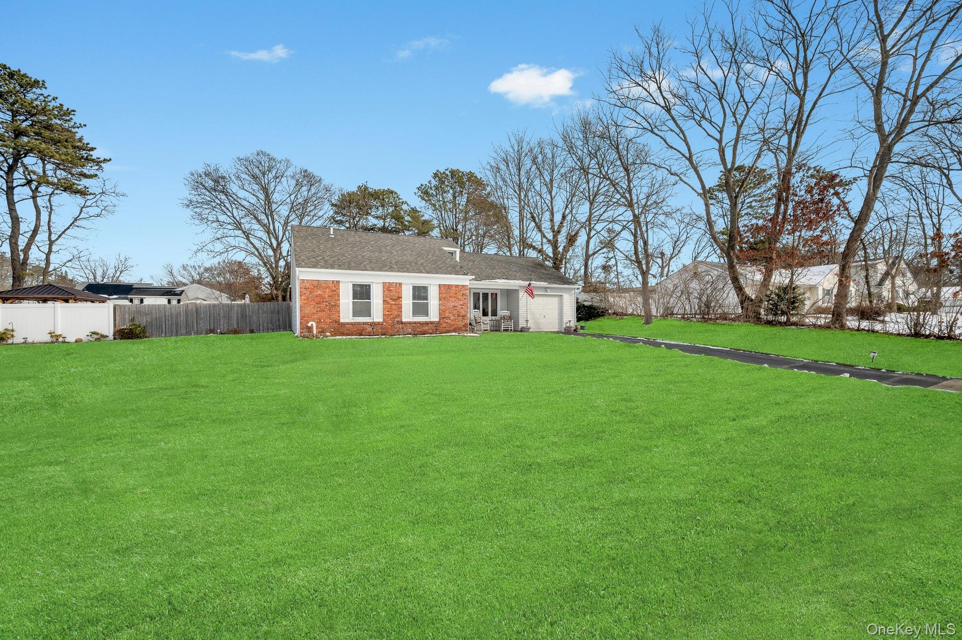 17 Groton Lane Coram, NY 11727 - Photo 8 of 34 a view of a building with a yard