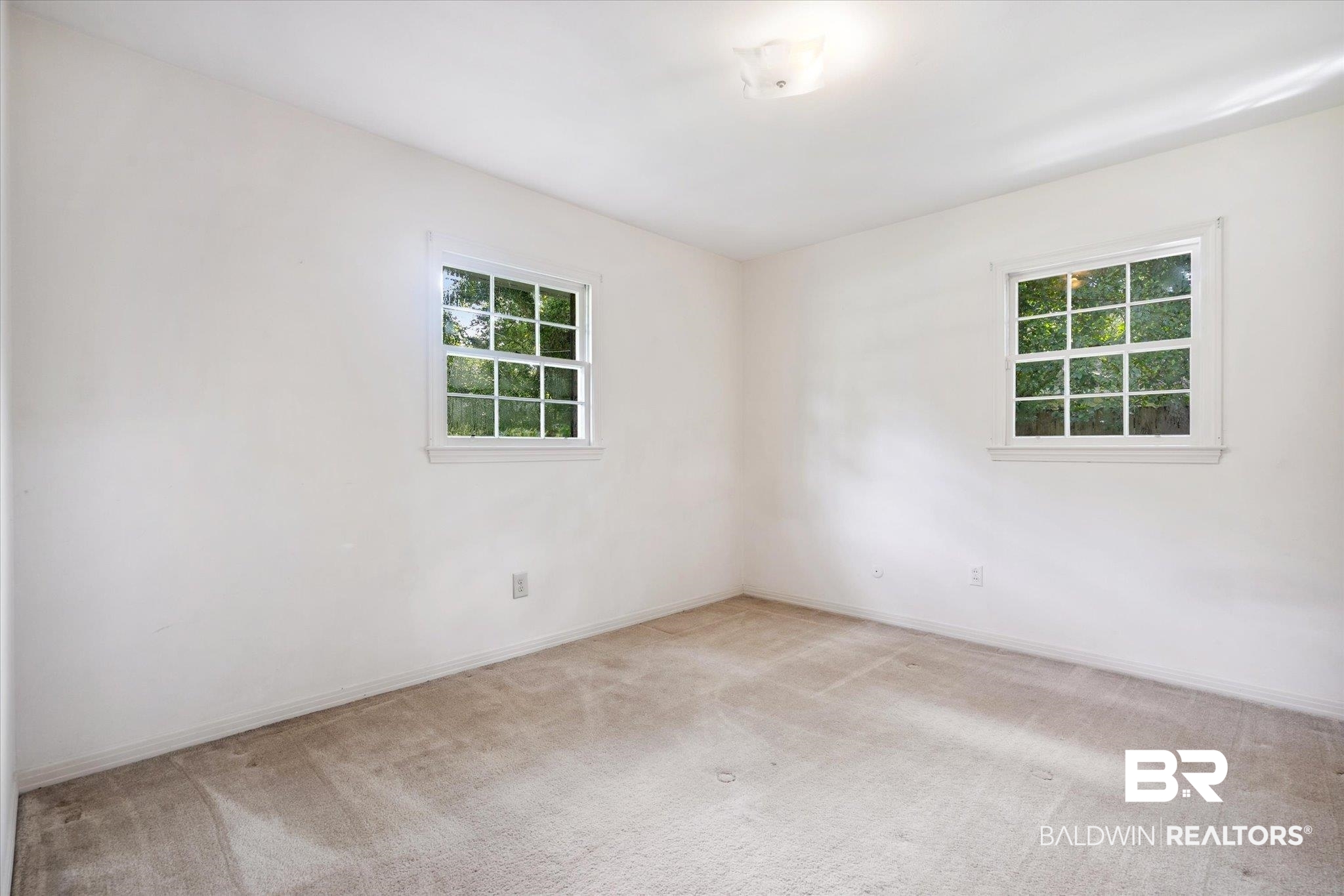 1252 Helm Circle Mobile, AL 36693 - Photo 14 of 18 Carpeted empty room featuring a healthy amount of sunlight