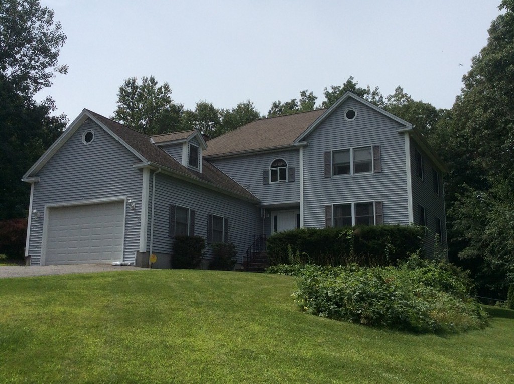 51 Allen Road Billerica, MA 01821 - Photo 1 of 24 a front view of a house with a garden