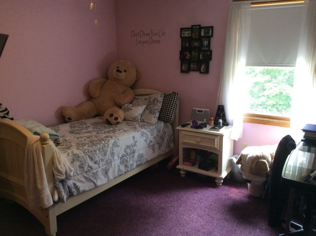 51 Allen Road Billerica, MA 01821 - Photo 13 of 24 a bedroom with a bed and a fireplace