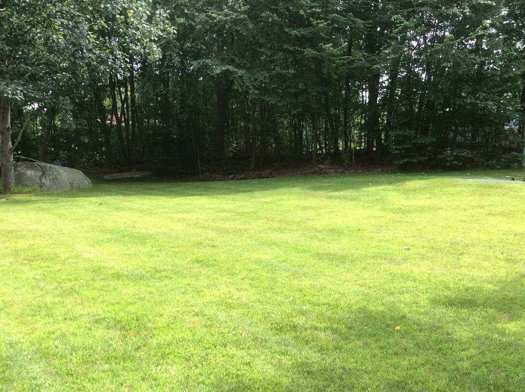 51 Allen Road Billerica, MA 01821 - Photo 18 of 24 a view of a swimming pool and a yard