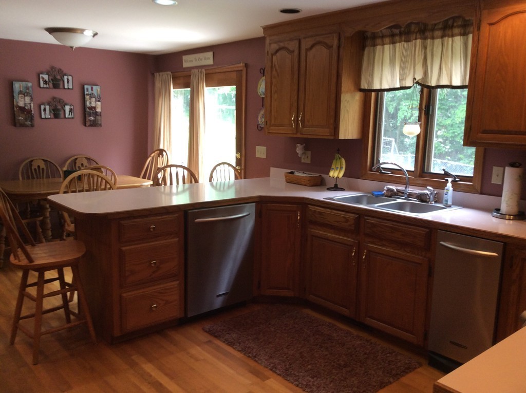 51 Allen Road Billerica, MA 01821 - Photo 3 of 24 a kitchen with a sink cabinets and window