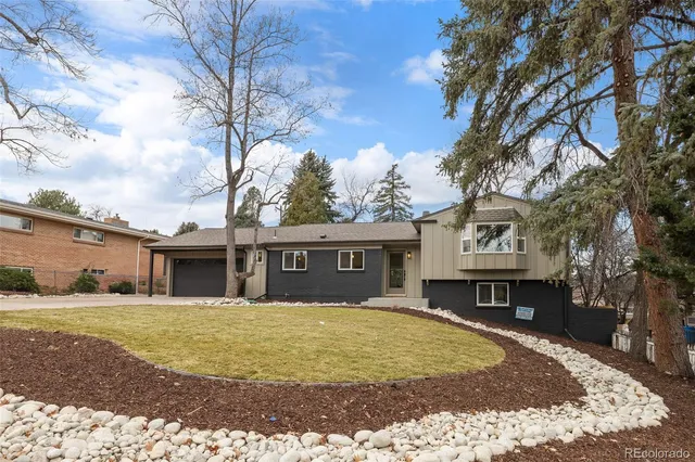 a view of house with outdoor space and sitting space