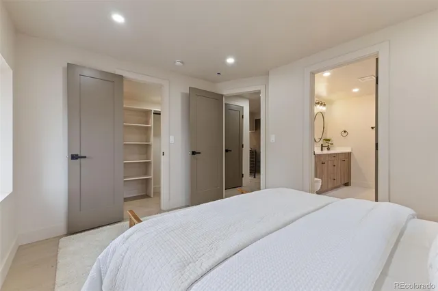 a bedroom with a bed and a shower