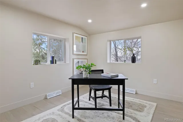 a workspace with furniture and window