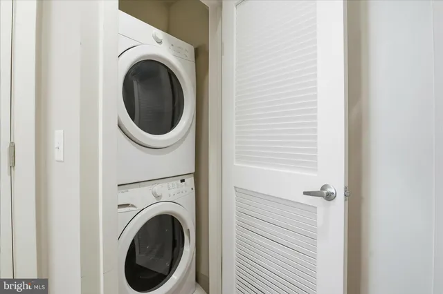 a view of a hallway with washer and dryer