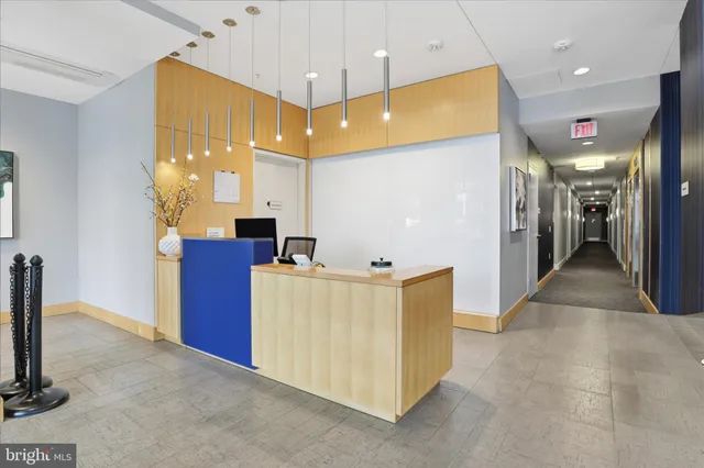 a view of kitchen with a refrigerator a sink and a fireplace