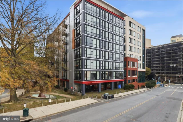 a view of tall building with street