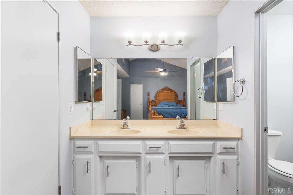 1000 Olive Drive, Unit 40 Bakersfield, CA 93308 - Photo 11 of 16 a bathroom with a sink and a mirror