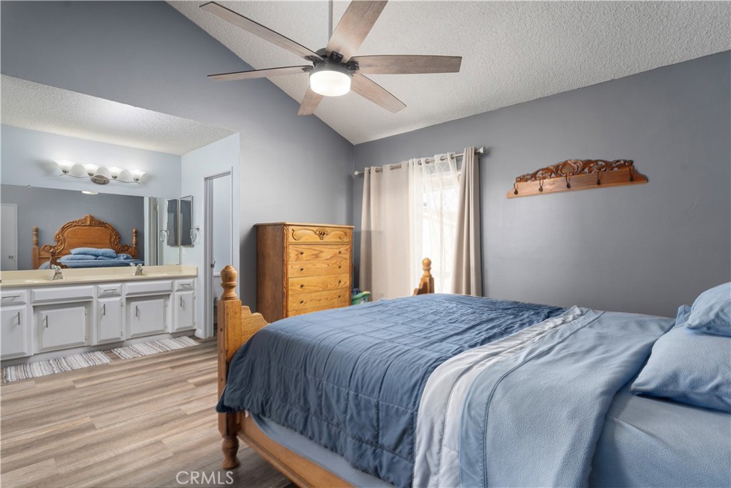 1000 Olive Drive, Unit 40 Bakersfield, CA 93308 - Photo 14 of 16 a bedroom with a bed and dresser