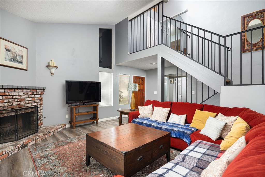 1000 Olive Drive, Unit 40 Bakersfield, CA 93308 - Photo 10 of 16 a living room with furniture and a flat screen tv