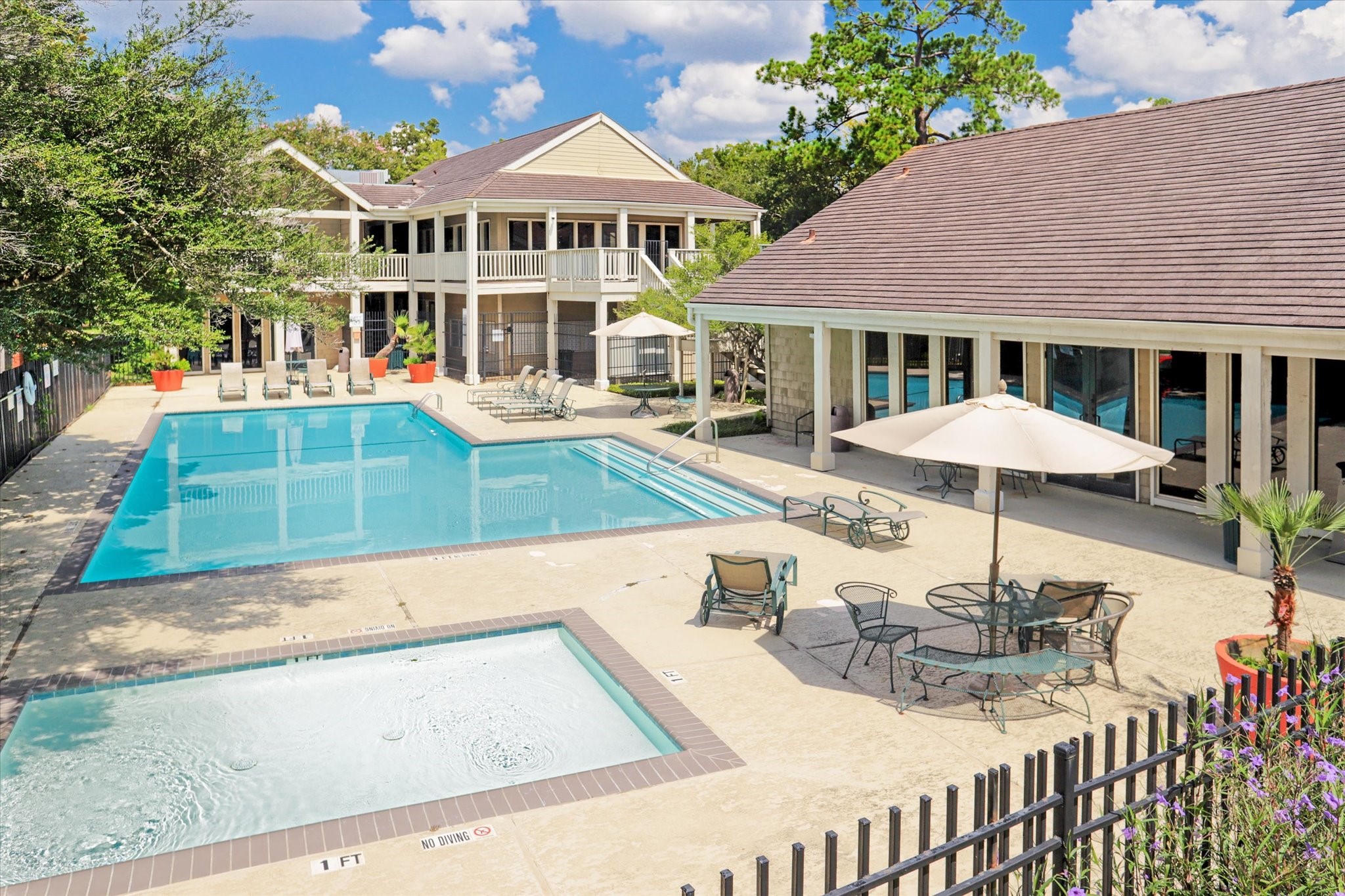 2100 Tanglewilde Street, Unit 318 Houston, TX 77063 - Photo 15 of 16 Oaks of Woodlake offers four full-size swimming pools plus a separate baby pool—multiple options for relaxing and enjoying sunny Houston days. Community clubhouse available for resident use.