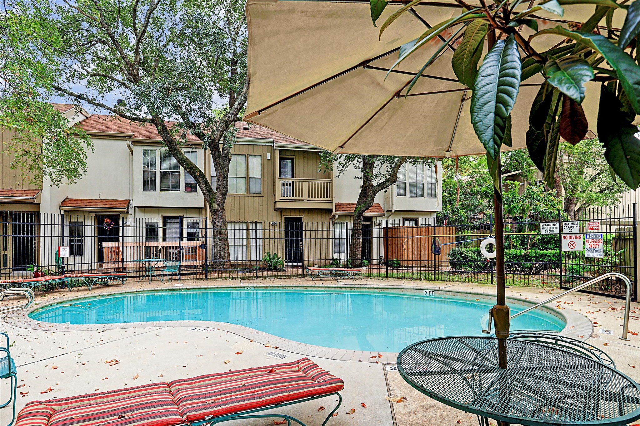 2100 Tanglewilde Street, Unit 318 Houston, TX 77063 - Photo 16 of 16 Enjoy access to the community pool, offering a refreshing retreat just steps from home.