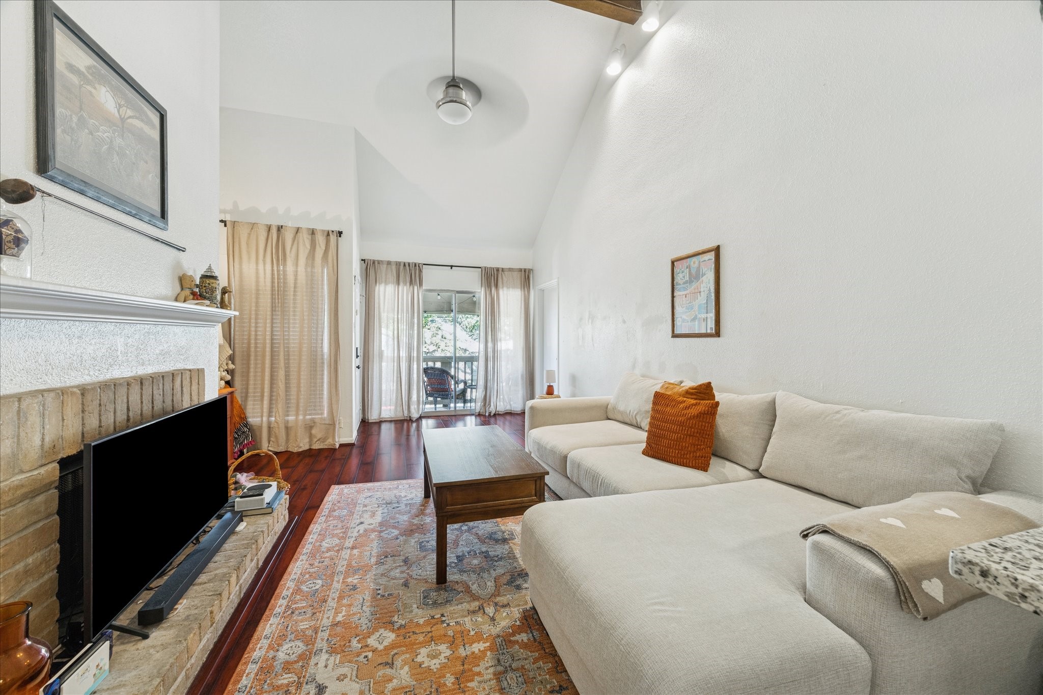 2100 Tanglewilde Street, Unit 318 Houston, TX 77063 - Photo 2 of 16 Spacious living room with great natural light and flexible layout options.