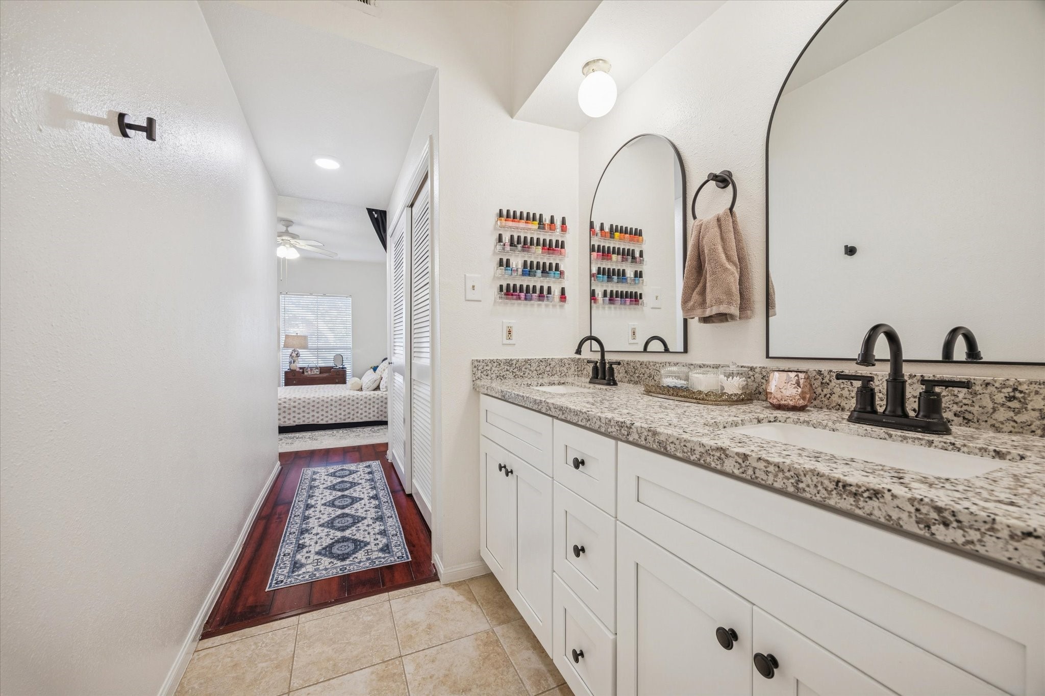 2100 Tanglewilde Street, Unit 318 Houston, TX 77063 - Photo 7 of 16 Primary bathroom featuring a tub/shower combination and practical storage.