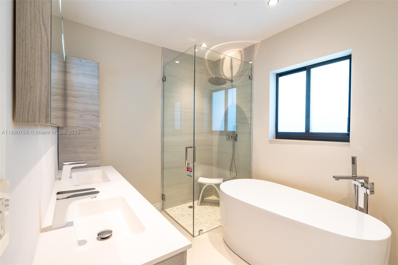 12905 Cherry Road North Miami, FL 33181 - Photo 12 of 22 a bathroom with a bathtub and a sink