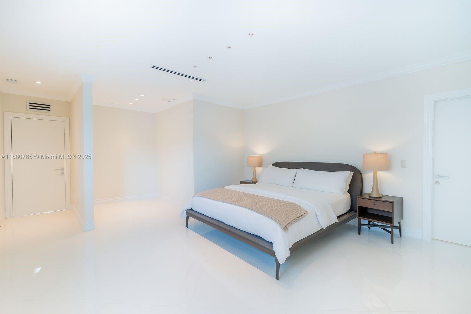 12905 Cherry Road North Miami, FL 33181 - Photo 16 of 22 a bed room with a bed and a night stand