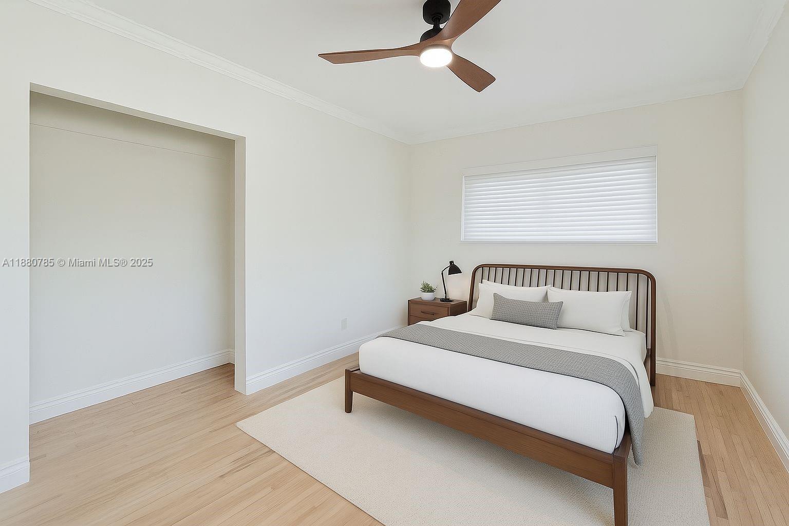 12905 Cherry Road North Miami, FL 33181 - Photo 18 of 22 a bedroom with a bed and a ceiling fan