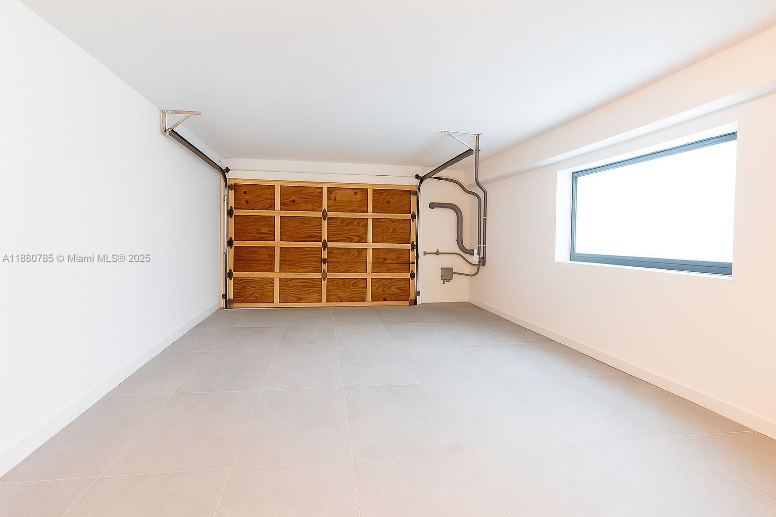 12905 Cherry Road North Miami, FL 33181 - Photo 22 of 22 a view of an empty room with a window