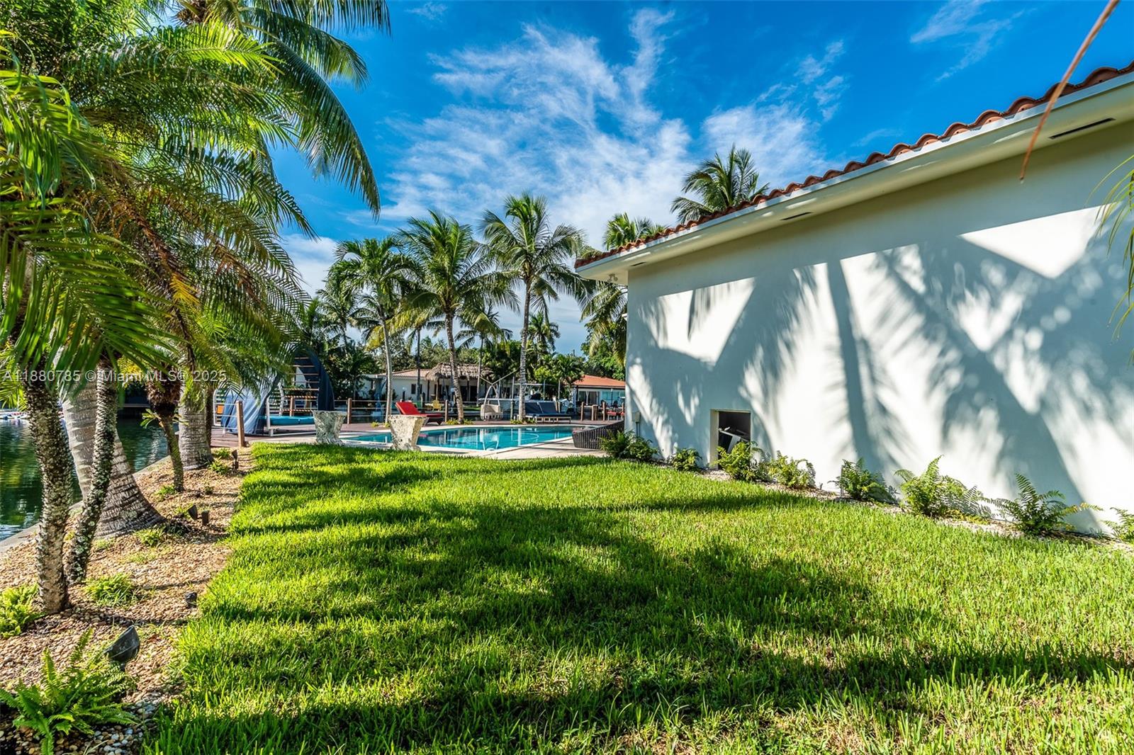 12905 Cherry Road North Miami, FL 33181 - Photo 4 of 22 a view of swimming pool with a yard