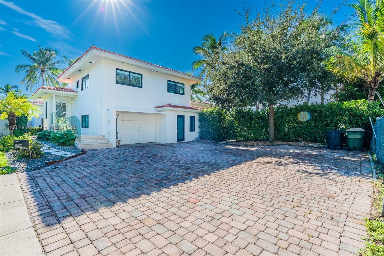 12905 Cherry Road North Miami, FL 33181 - Photo 10 of 22 a front view of a house with a yard