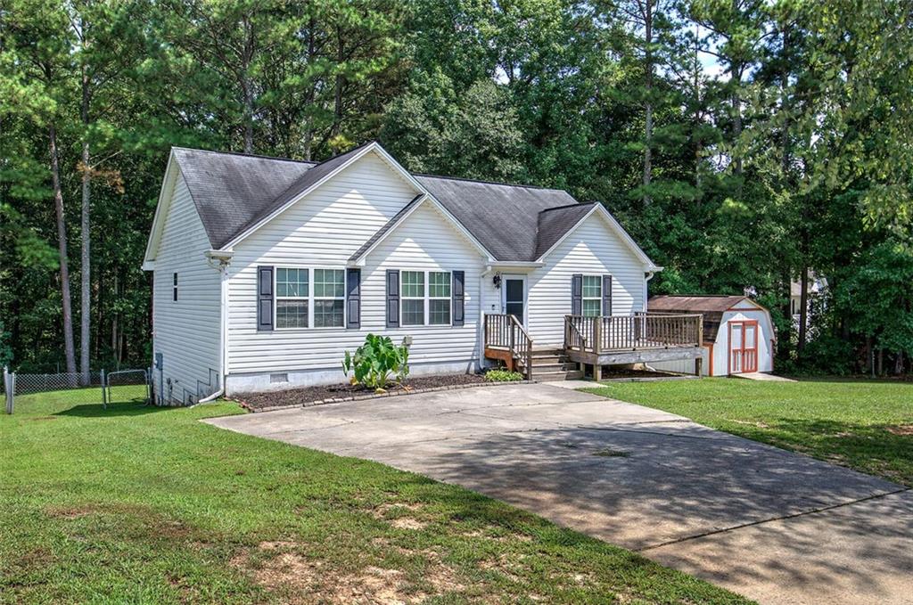 a front view of a house with a yard and porch
