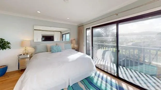 a view of a patio with couches table and chairs and potted plants