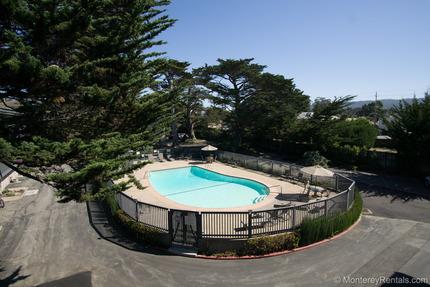1 La Playa Street Monterey, CA 93940 - Photo 3 of 17 a view of a swimming pool with a yard and outdoor seating